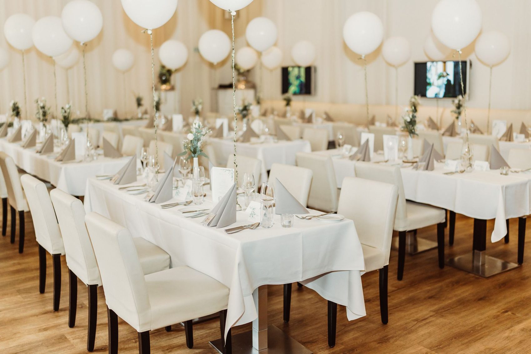 Reception room set with white linen and lanterns