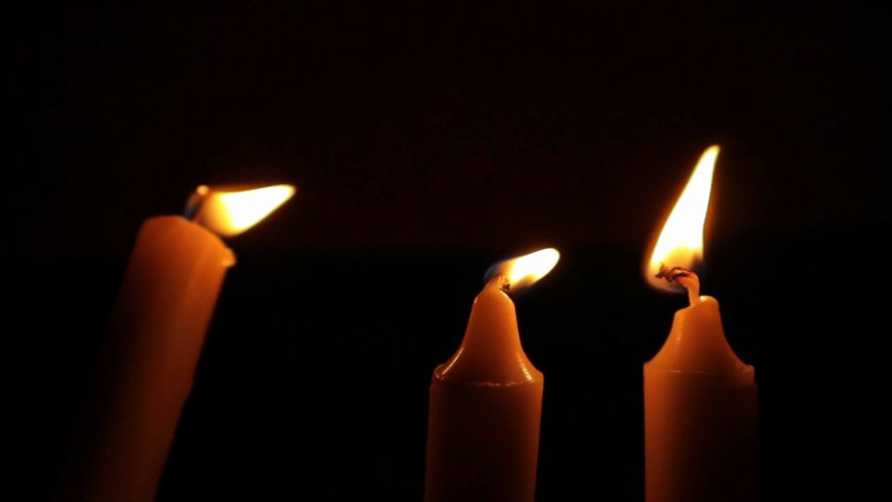Candles being lit one after another